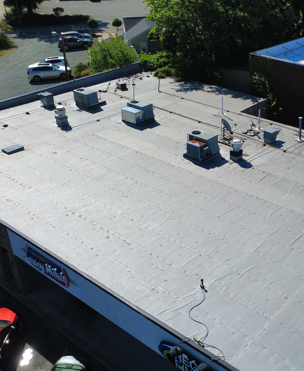 Aerial view of a new commercial roof.