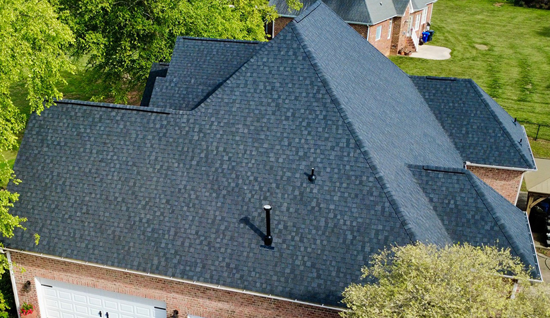 White home with a shingle roof.