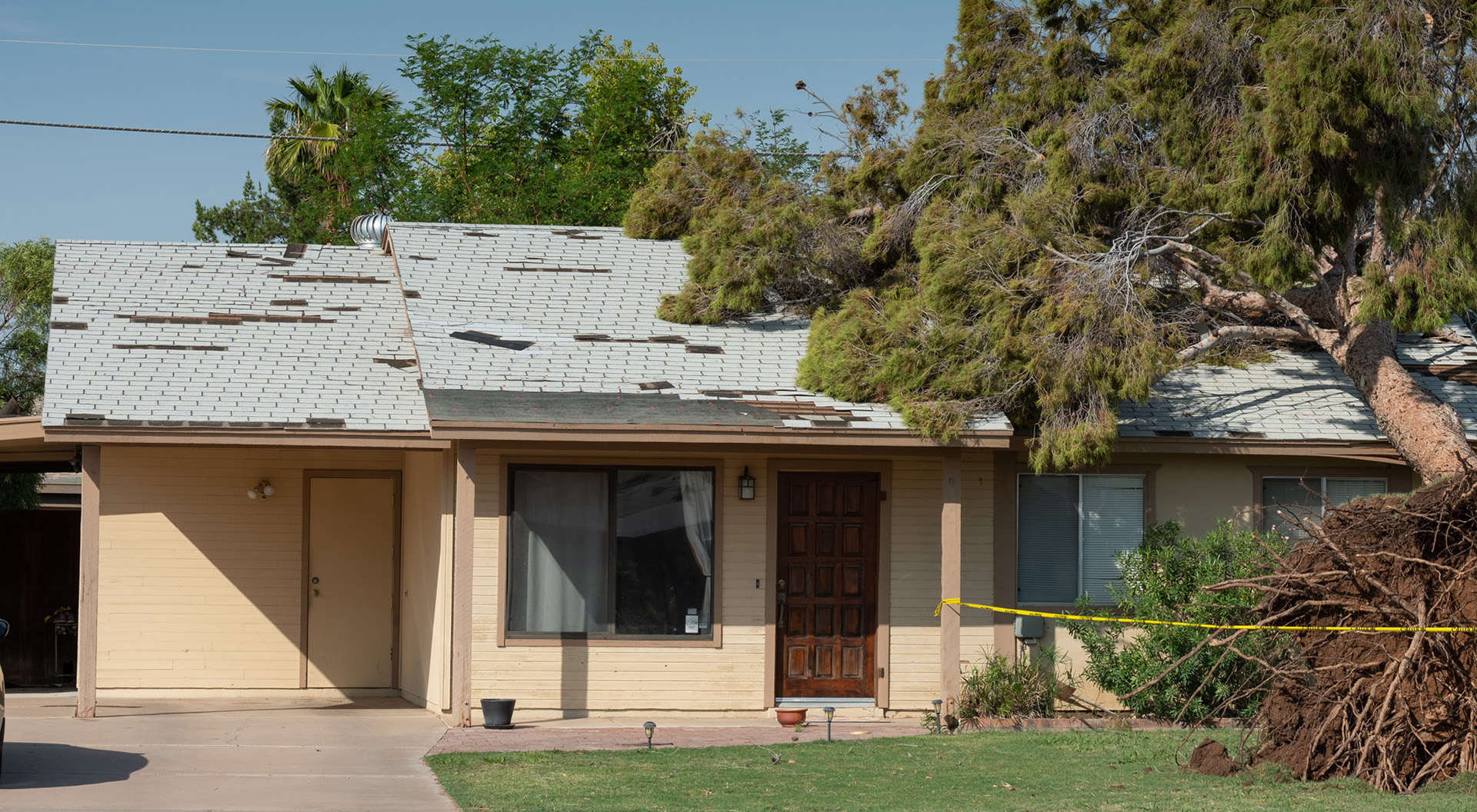White home with a shingle roof.