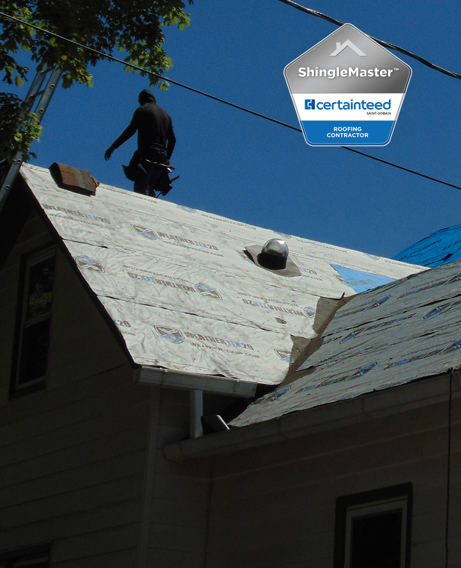Aerial view of a new residential shingle roof.